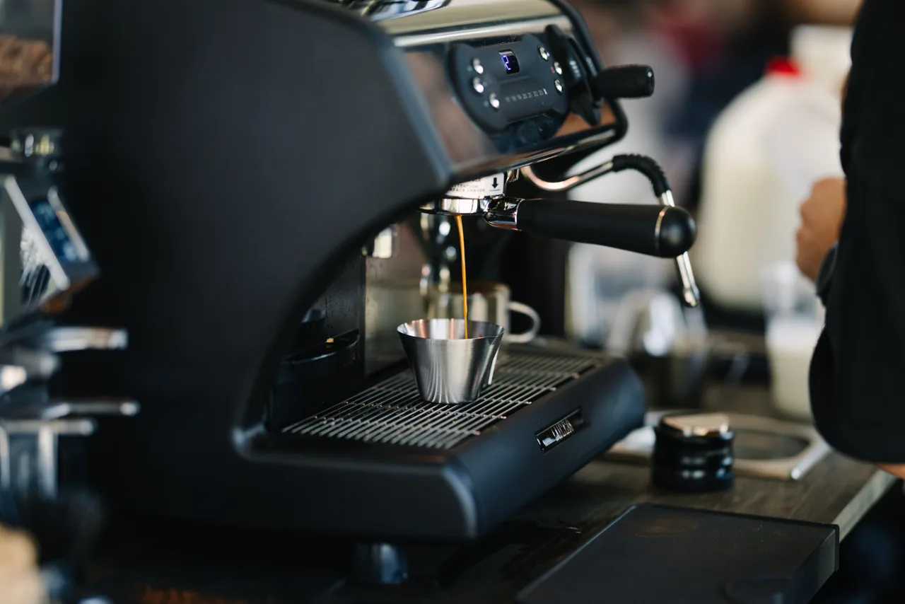 Fresh espresso pouring at the Sunrise coffee cart