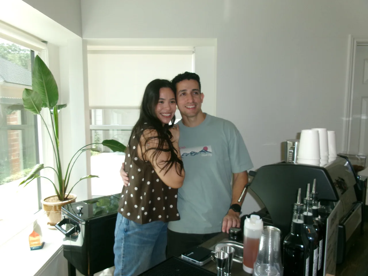 AJ and Mishael together beside the Sunrise coffee cart